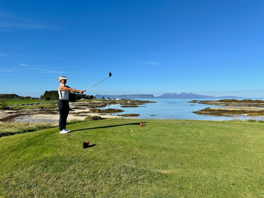 A man is playing golf on a golf course
