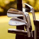 gray steel golf clubs on selective focus photo