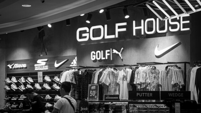 a black and white photo of a golf store