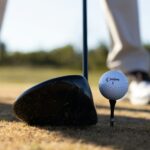 white golf ball on black golf club
